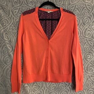 Coral cardigan with bold navy geometric print